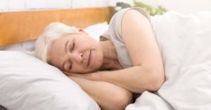 senior-woman-sleeping-in-bed-in-morning